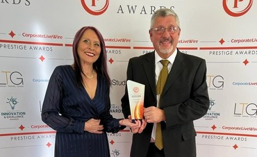 Managers, Jill Raine & John Griffiths accept Prestige Award 