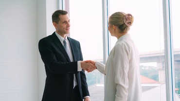 Solicitor and client hand shaking